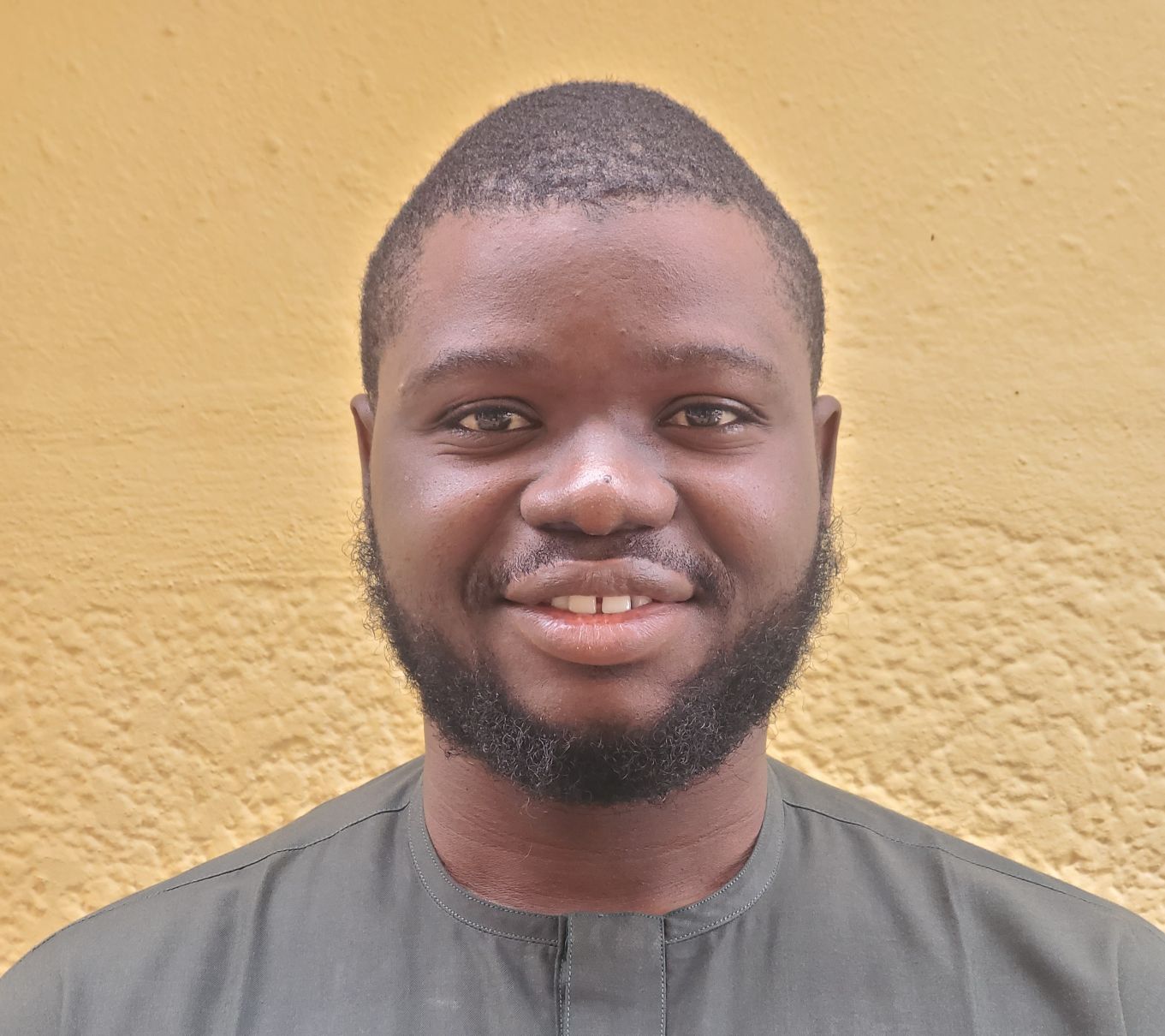 Professional portrait of African female executive in business attire with confident expression in modern office