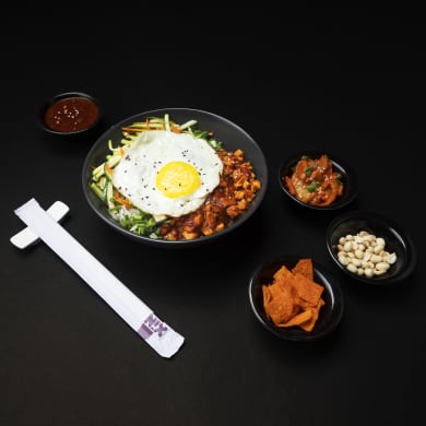 A Bibimbap Master Bowl at Xin — sesame rice, hand-cut vegetables, gochujang, runny egg
