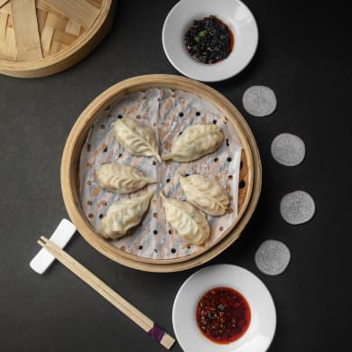 A bamboo basket of hand-folded dim sum at Xin HSR — char siu bao, siu mai, prawn har gao