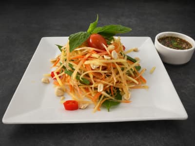 Xin Som Tam — Thai green papaya salad pounded with chilli, lime, palm sugar, peanuts and cherry tomatoes