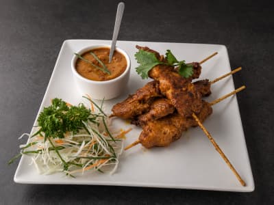 Xin Satay Skewers — Indonesian-Malay grilled chicken skewers in peanut-turmeric marinade, spicy peanut sauce