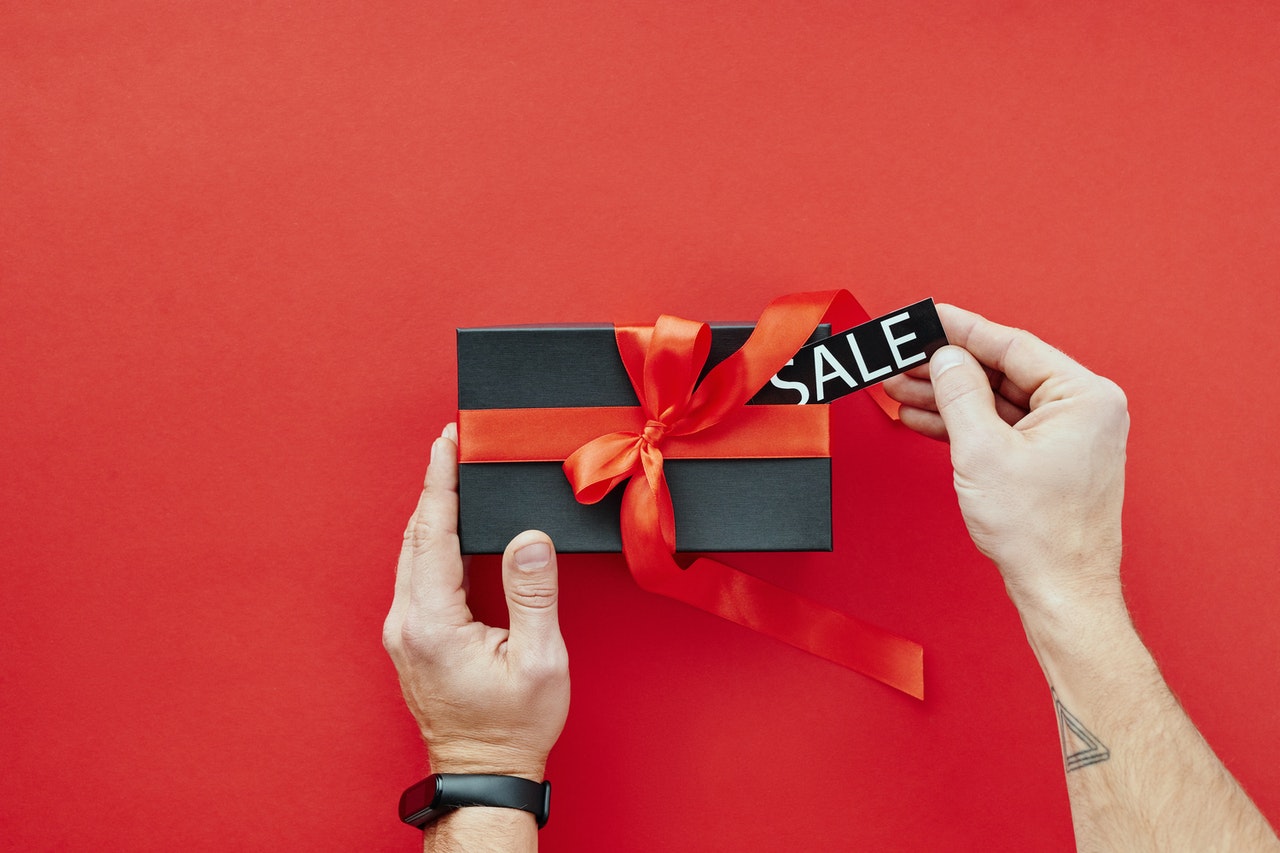 male hand opening sale gift box