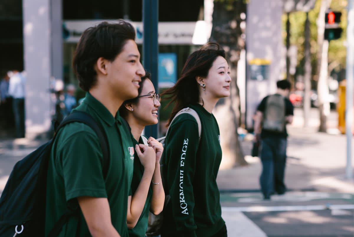Students walking on street.