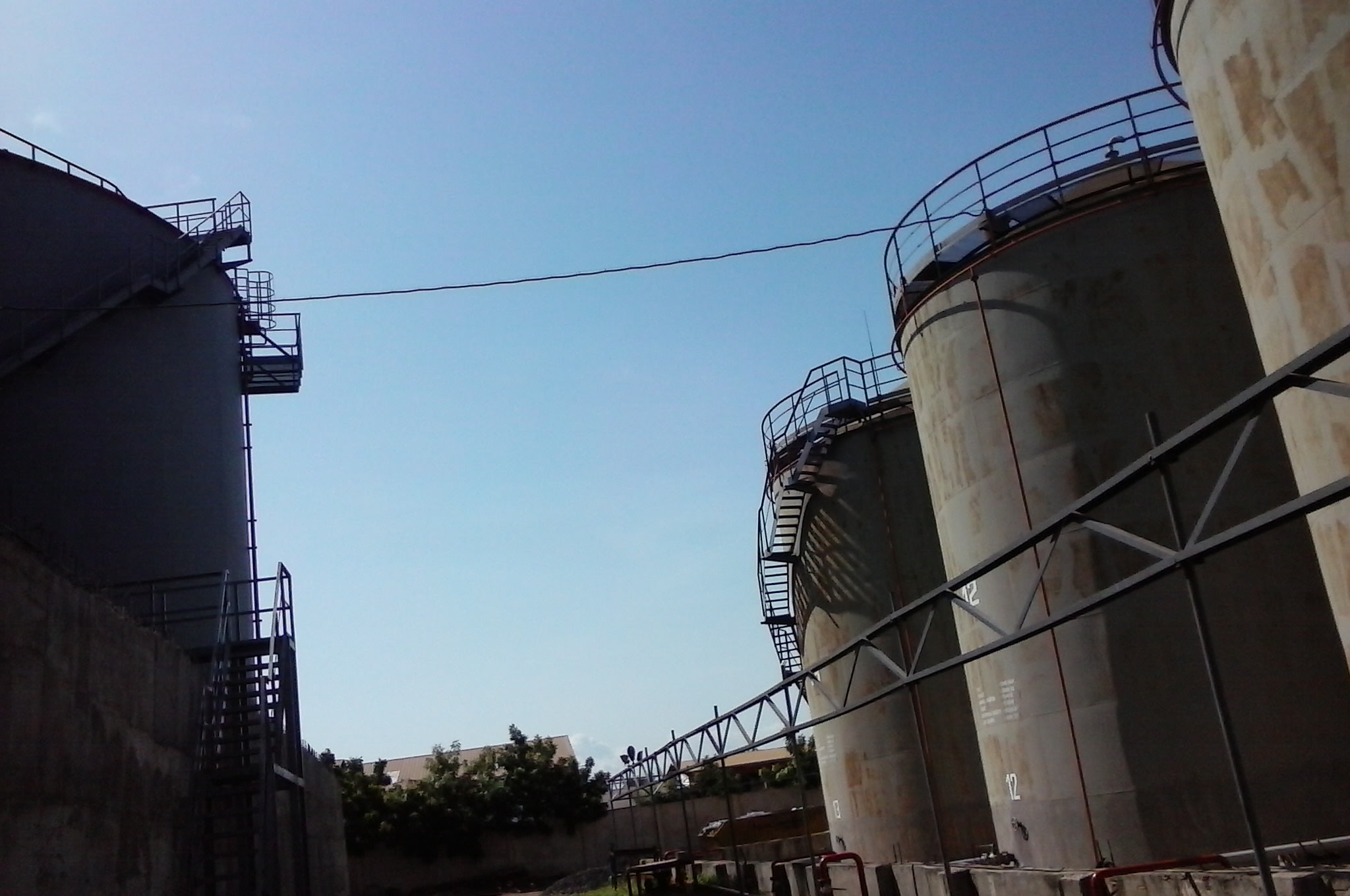 Large metal industrial oil storage tanks at Platon facility
