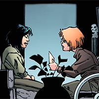 Batman issue 567. Cass sits in front of Barbara, while Barbara, in her wheelchair, leans in and shows her flash cards, teaching her to speak.