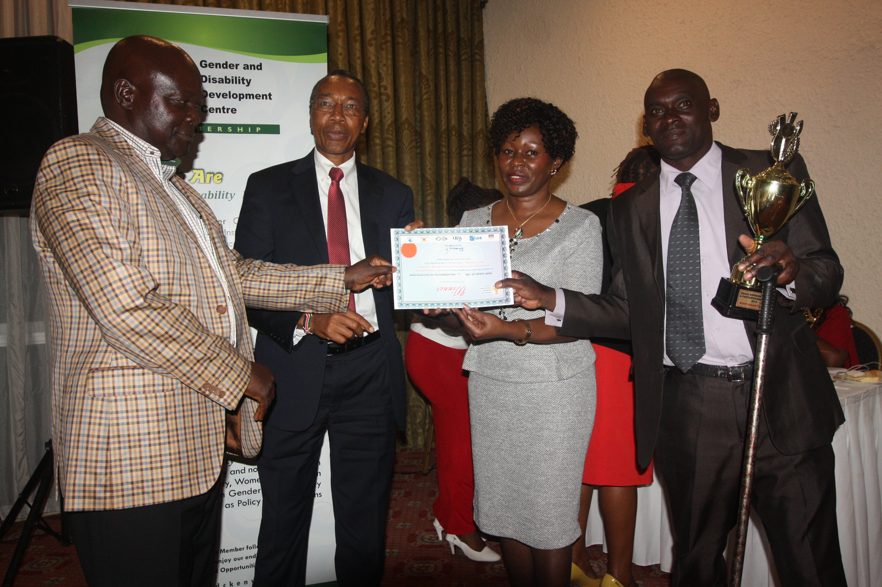 H.E Gerald Githinji Issuing and Award to Sony Sugar MD Jane Pamella Odhiambo and other staff members