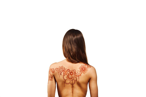 Henna artist creating intricate designs