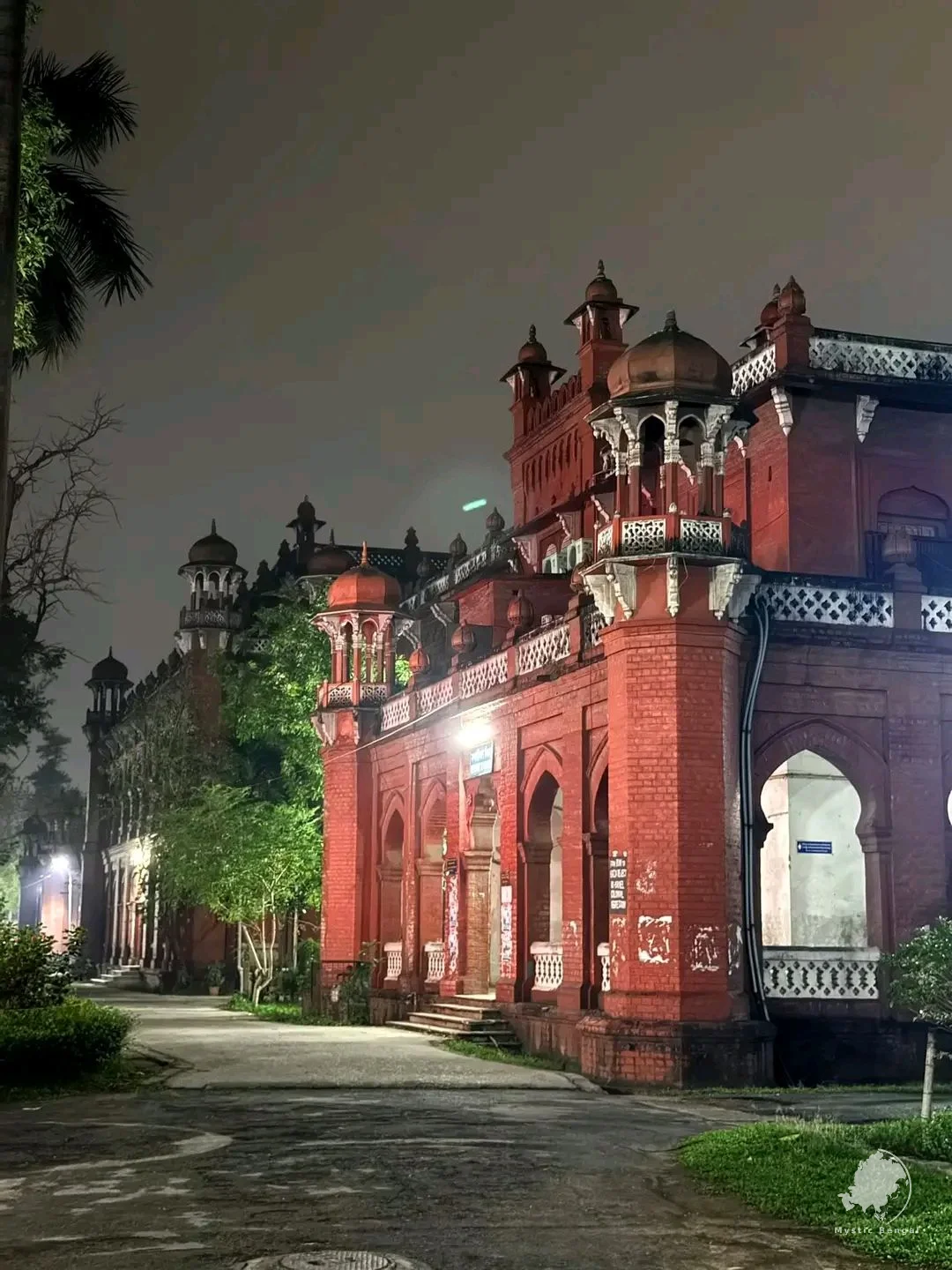 Dhaka University campus area with historic buildings and student atmosphere
