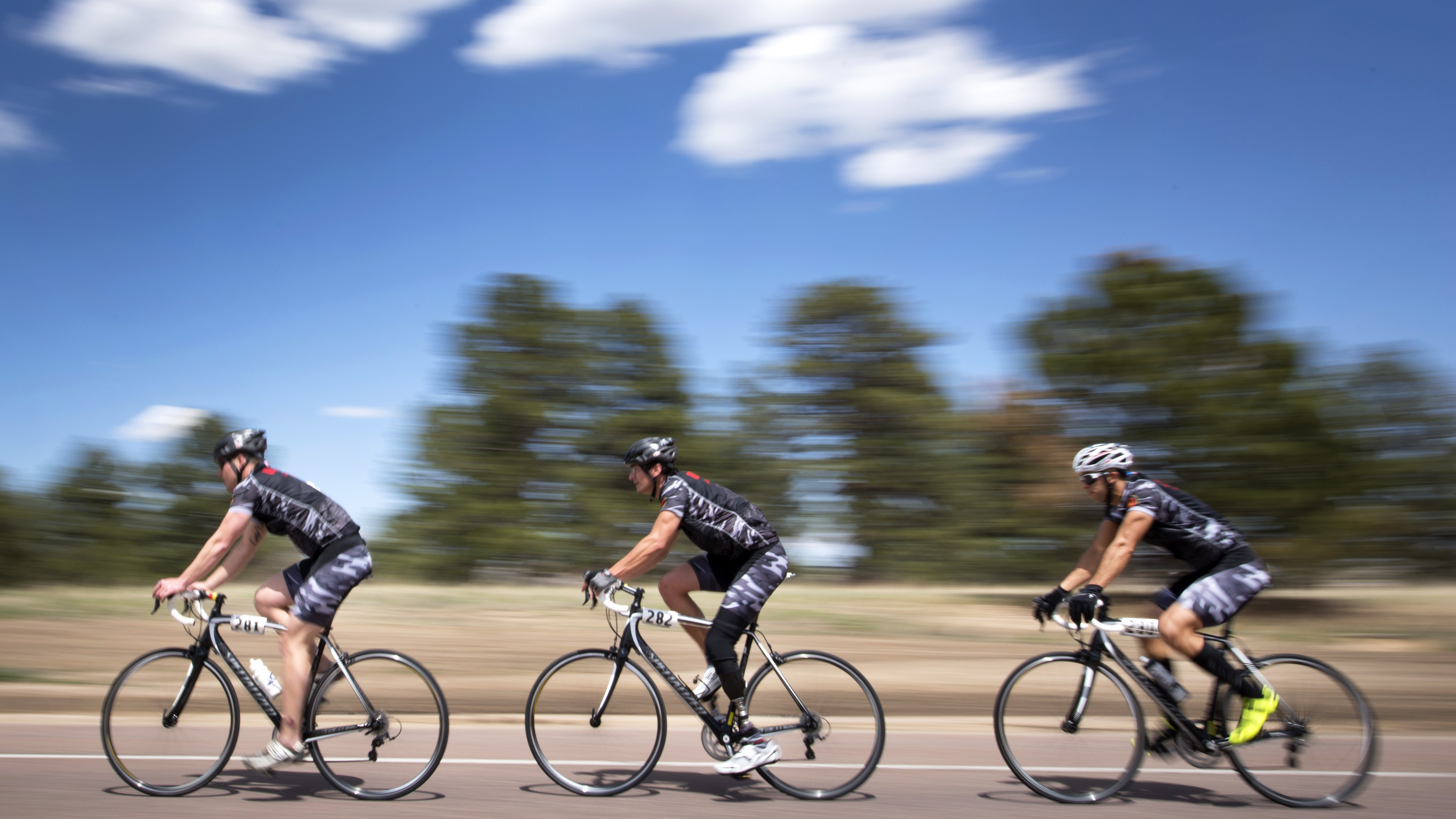 injured cyclists on road