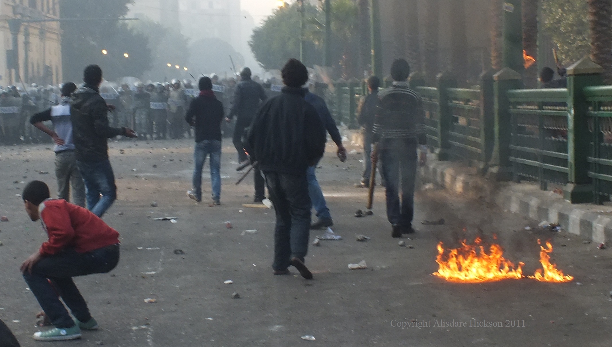 crowd police baton clash