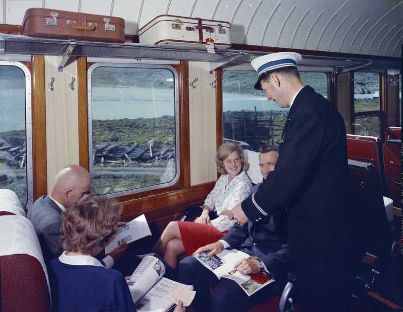 train interior passenger checking tickets