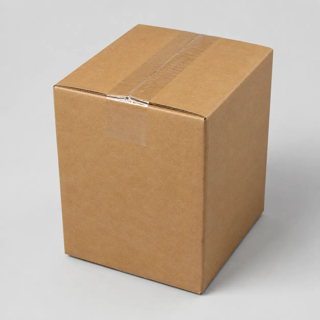 Top view of 5.5x5.5x8 inch brown carton box with adhesive tape seam