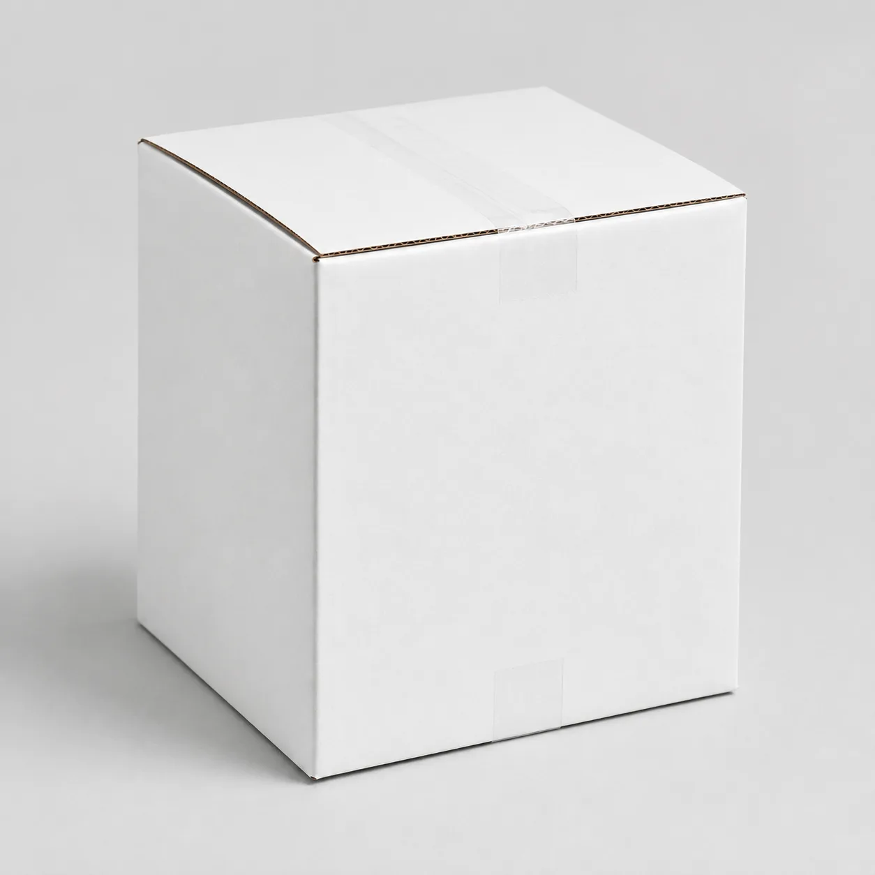 Front angle view of 5.5x5.5x8 inch white taped corrugated carton box