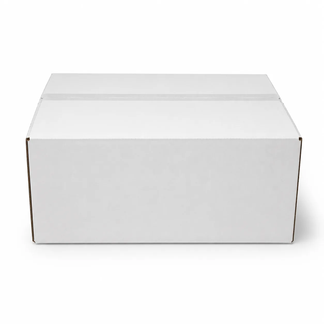 Close-up view of white corrugated carton material and tape area