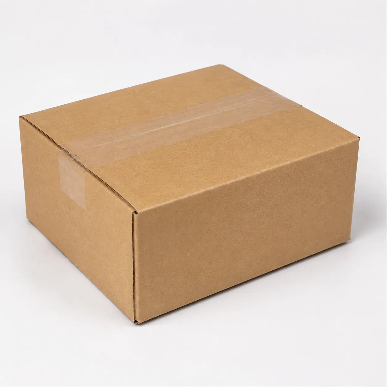Top view of 5x5x2.75 inch brown carton box with adhesive tape seam