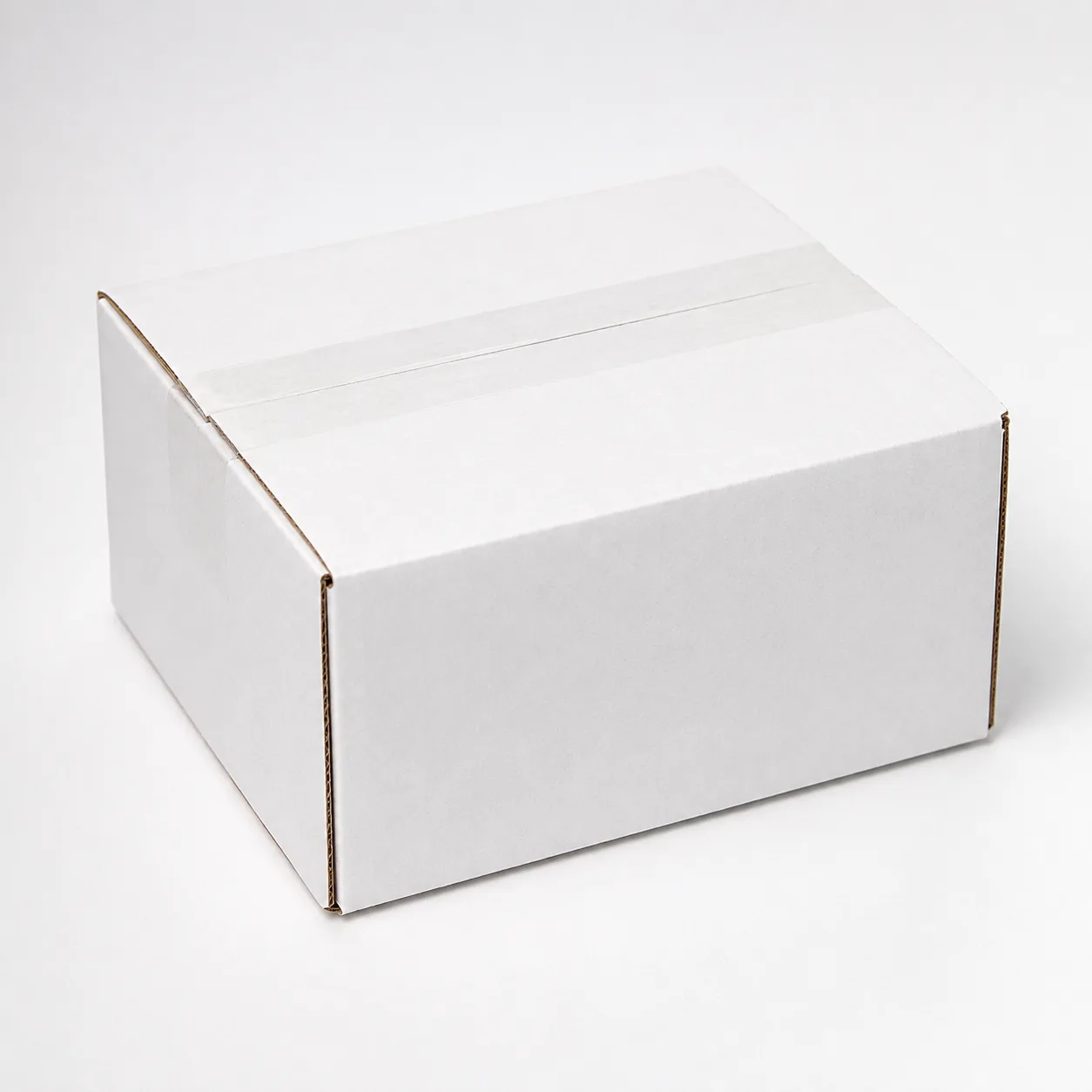 Side view of 5x5x2.75 inch white corrugated shipping carton