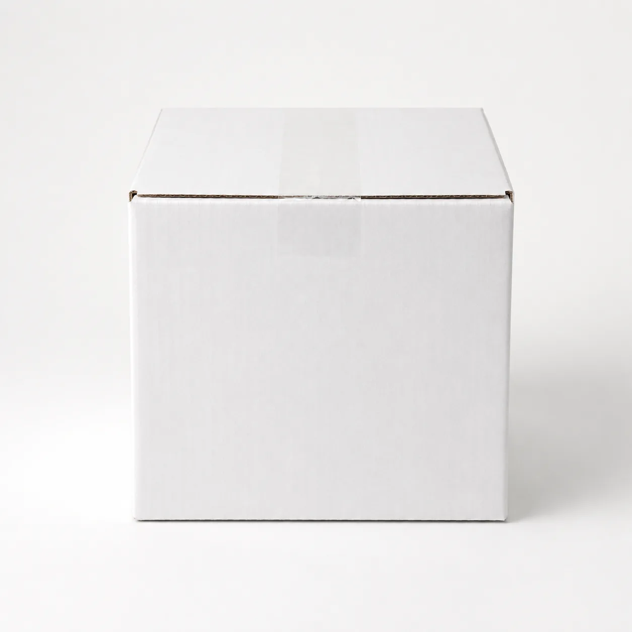 Front angle view of 4.75x4.75x4 inch white taped corrugated carton box