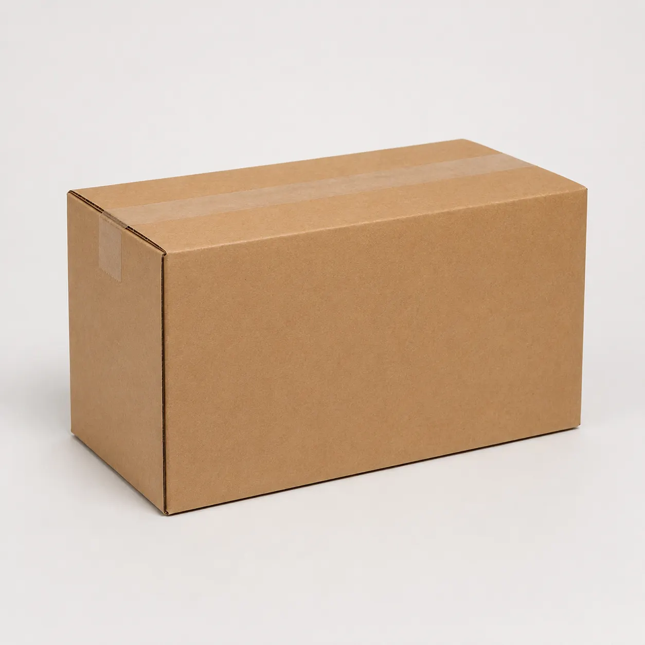 Close-up view of brown corrugated carton material and tape area