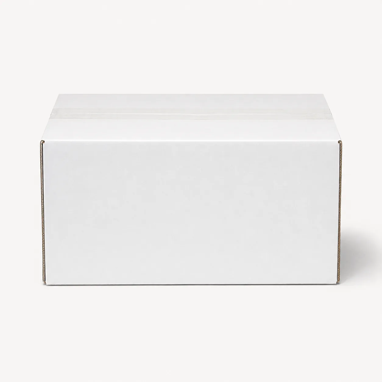 Front angle view of 5.75x13.5x8.75 inch white taped corrugated carton box