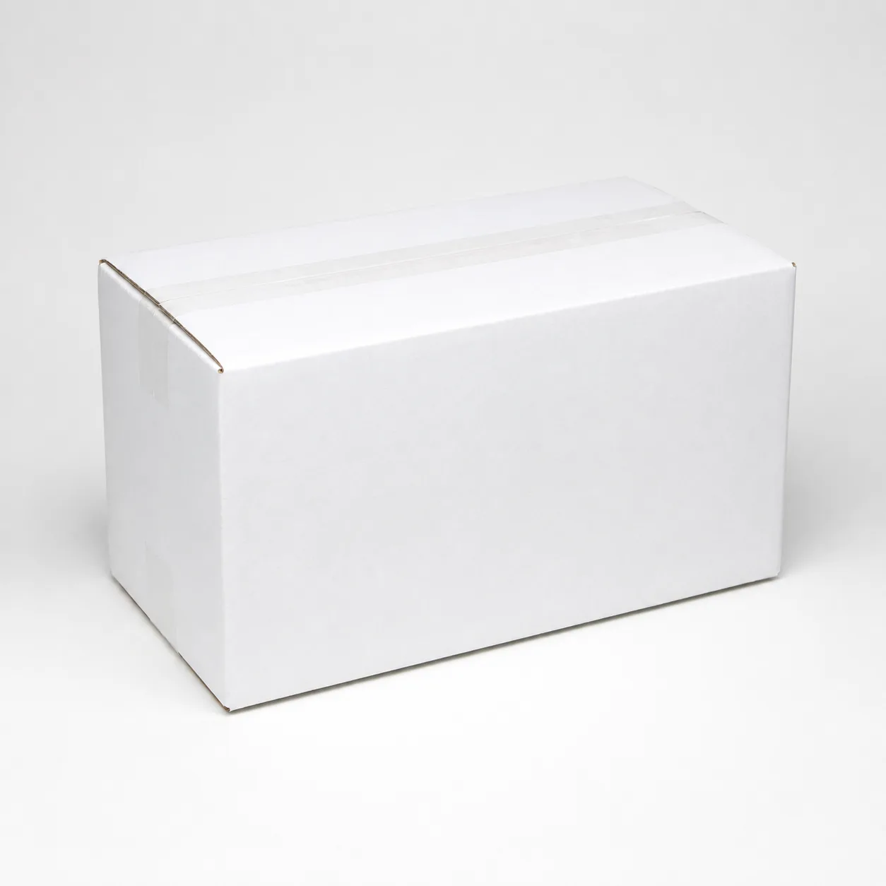 Top view of 5.75x13.5x8.75 inch white carton box with adhesive tape seam