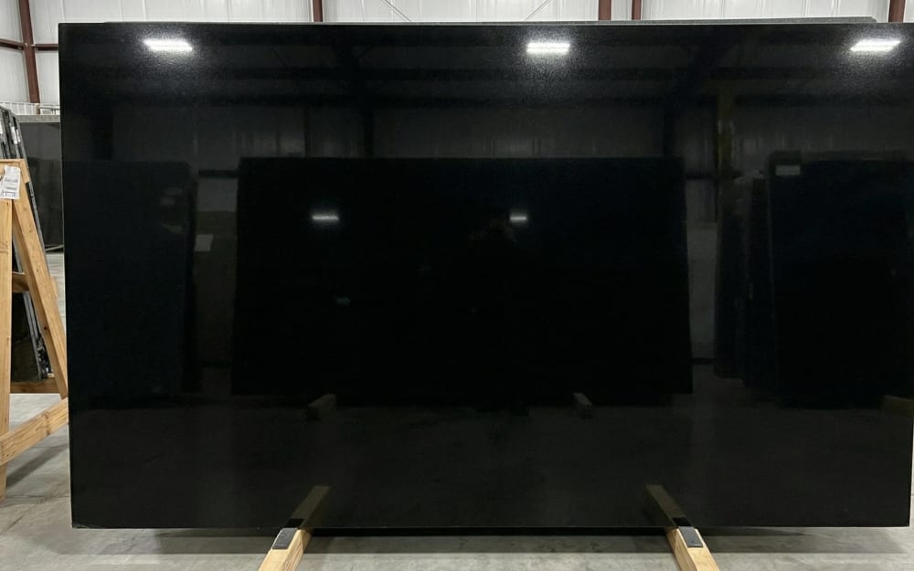 Absolute Black granite — polished slab surface showing Black coloring. Origin: India (Andhra Pradesh). Hardness: 6 Mohs. Acid sensitivity: none.
