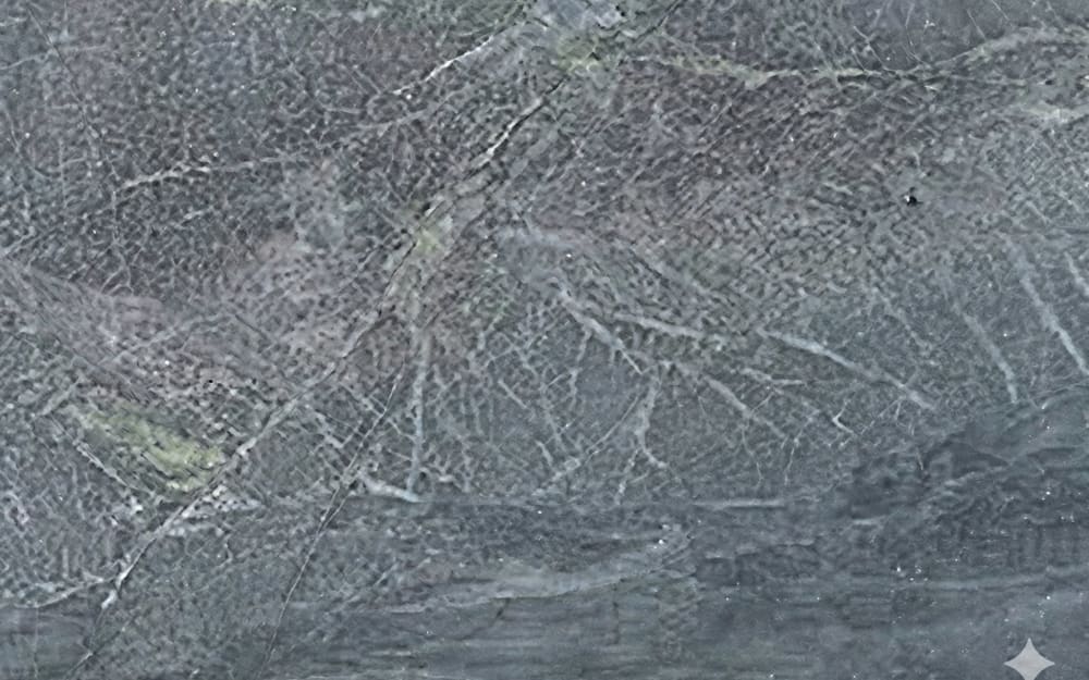 African Soapstone soapstone — polished slab surface showing Grey coloring. Origin: Zimbabwe / Uganda. Hardness: 1 Mohs. Acid sensitivity: none.
