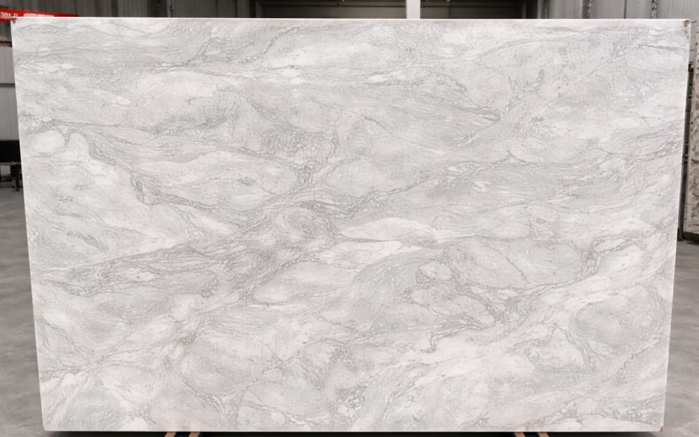 Alba Pietra marble — polished slab surface showing White coloring. Origin: Italy. Hardness: 3 Mohs. Acid sensitivity: high.