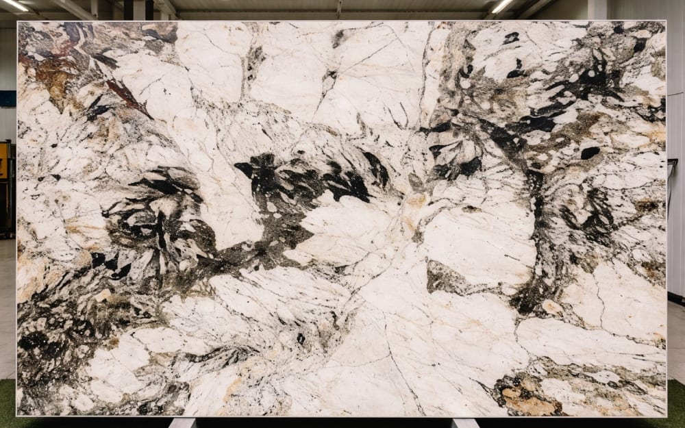 Alpinus granite — polished slab surface showing Grey coloring. Origin: Brazil. Hardness: 6 Mohs. Acid sensitivity: none.