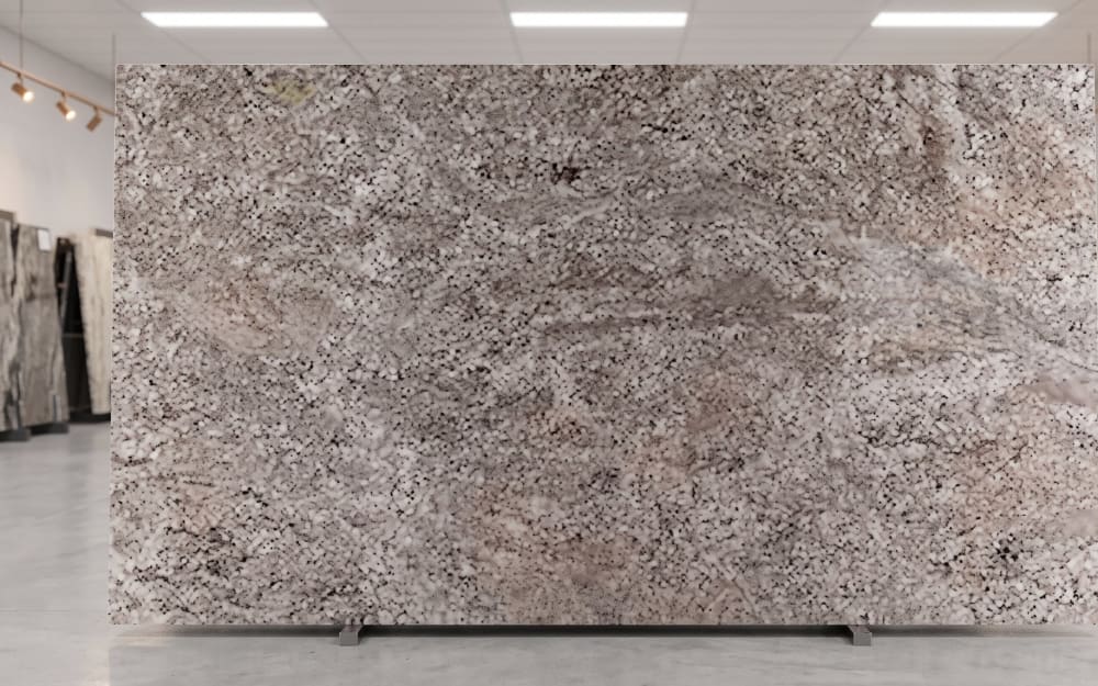 Arctic Sand granite — polished slab surface showing Tan/Beige coloring. Origin: Brazil. Hardness: 6 Mohs. Acid sensitivity: none.