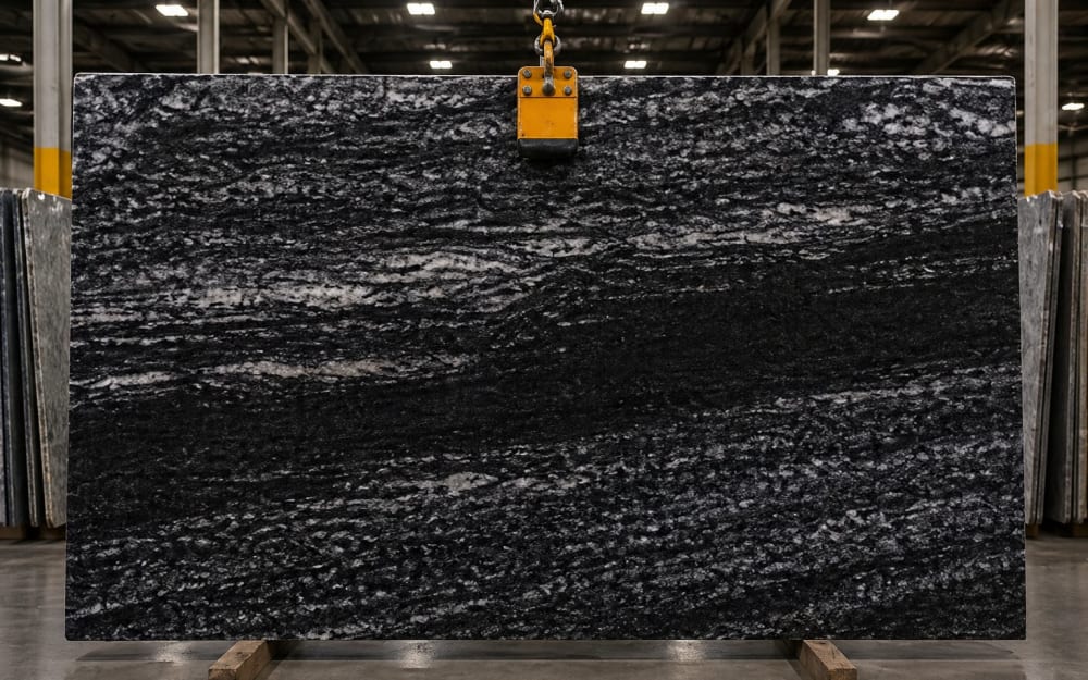 Black Space granite — polished slab surface showing Black coloring. Origin: Brazil. Hardness: 6 Mohs. Acid sensitivity: none.