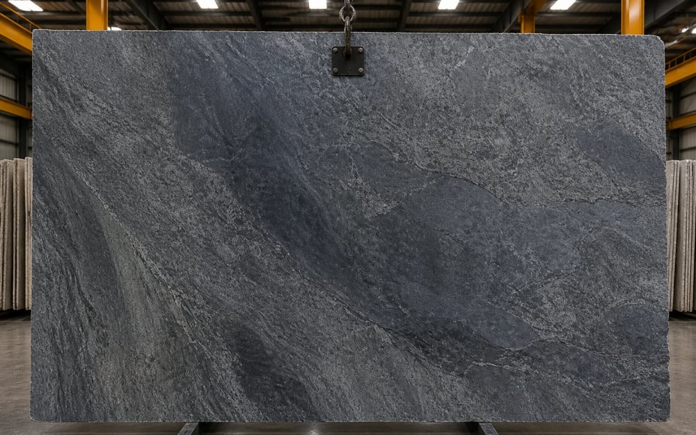 Brazilian Soapstone (Pedra Sabão) soapstone — polished slab surface showing Grey coloring. Origin: Brazil (Minas Gerais). Hardness: 1 Mohs. Acid sensitivity: none.
