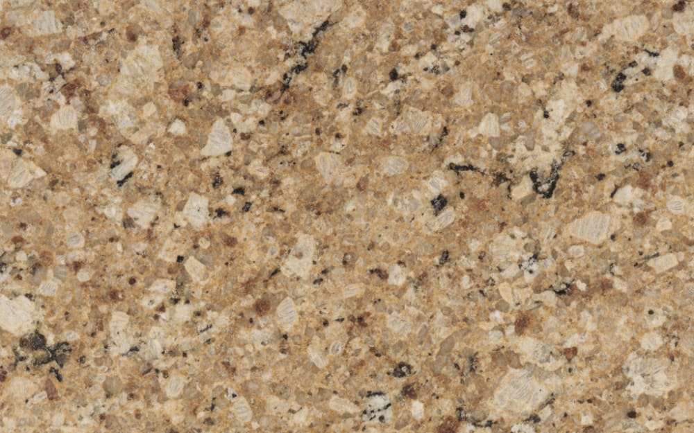 Butterfly Beige granite — polished slab surface showing Cream coloring. Origin: Brazil. Hardness: 6 Mohs. Acid sensitivity: none.
