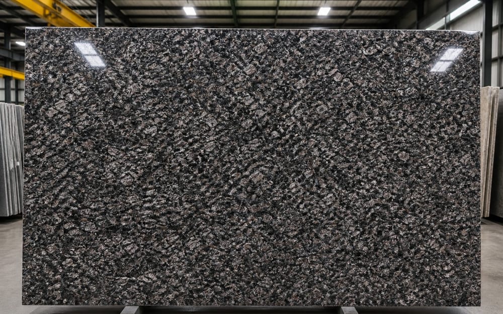 Café Imperial granite — polished slab surface showing Grey coloring. Origin: Brazil. Hardness: 6 Mohs. Acid sensitivity: none.