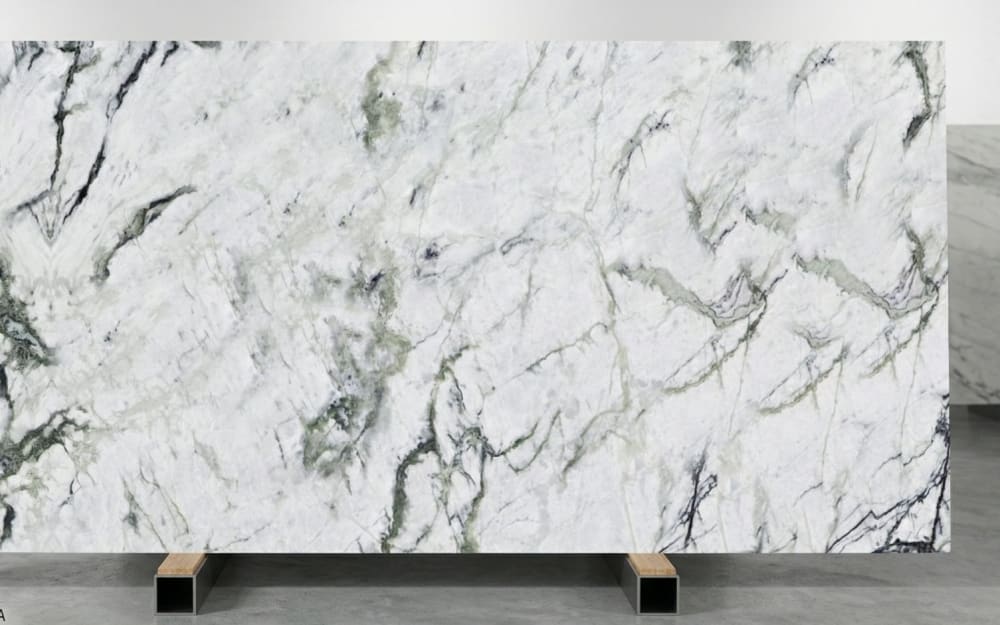 Calacatta Verde marble — polished slab surface showing Green coloring. Origin: Italy (Carrara). Hardness: 3 Mohs. Acid sensitivity: high.