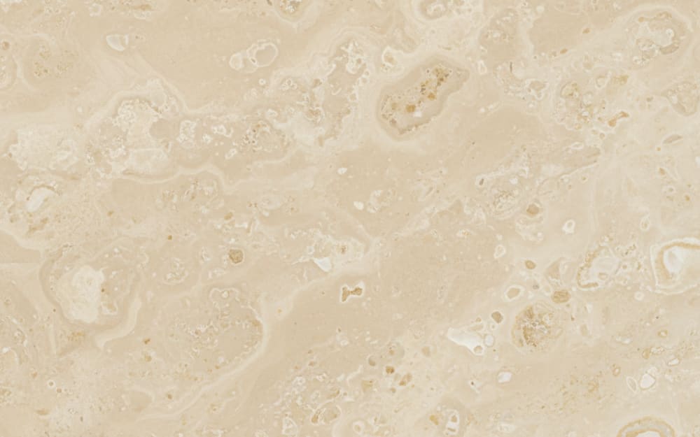 Champagne Beige limestone — polished slab surface showing Cream coloring. Origin: Turkey. Hardness: 3 Mohs. Acid sensitivity: high.