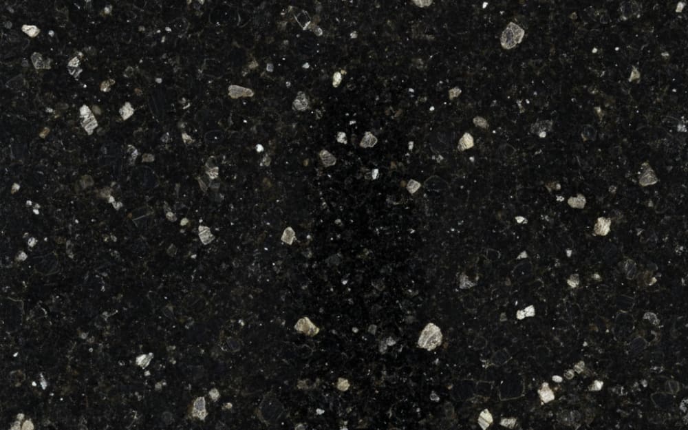 Cosmic Black granite — polished slab surface showing Black coloring. Origin: India. Hardness: 6 Mohs. Acid sensitivity: none.