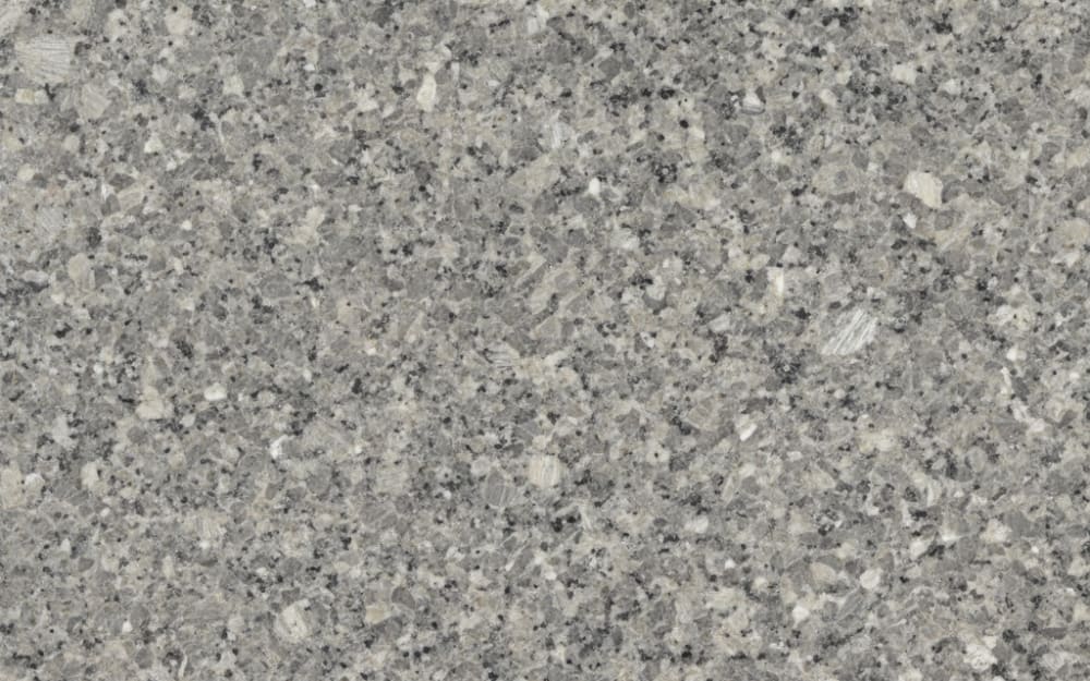 Costa Smeralda granite — polished slab surface showing Grey coloring. Origin: Italy (Sardinia). Hardness: 6 Mohs. Acid sensitivity: none.