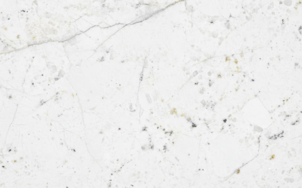 Cotton White granite — polished slab surface showing White coloring. Origin: Brazil. Hardness: 6 Mohs. Acid sensitivity: none.