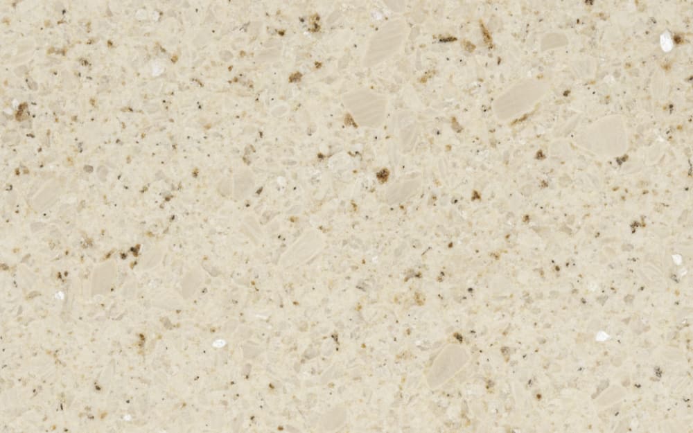 Crema Pearl granite — polished slab surface showing Cream coloring. Origin: Spain. Hardness: 6 Mohs. Acid sensitivity: none.