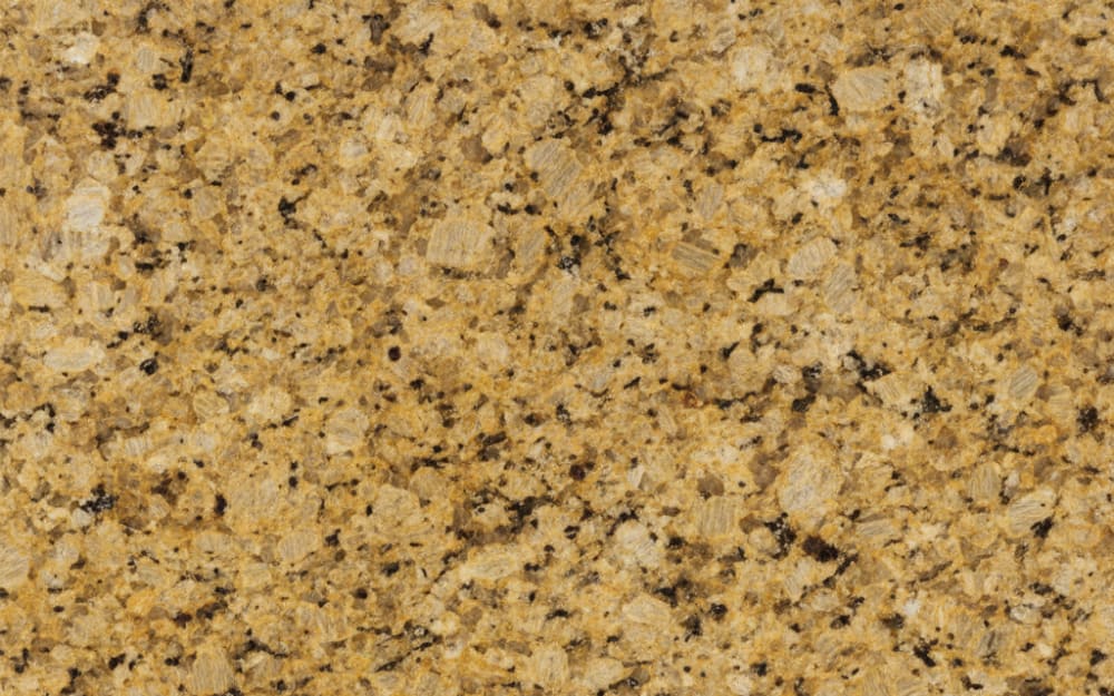 Desert Gold granite — polished slab surface showing Gold/Yellow coloring. Origin: India. Hardness: 6 Mohs. Acid sensitivity: none.