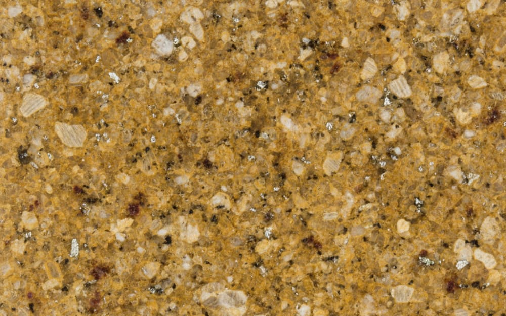 Diamond Gold granite — polished slab surface showing Gold/Yellow coloring. Origin: India. Hardness: 6 Mohs. Acid sensitivity: none.