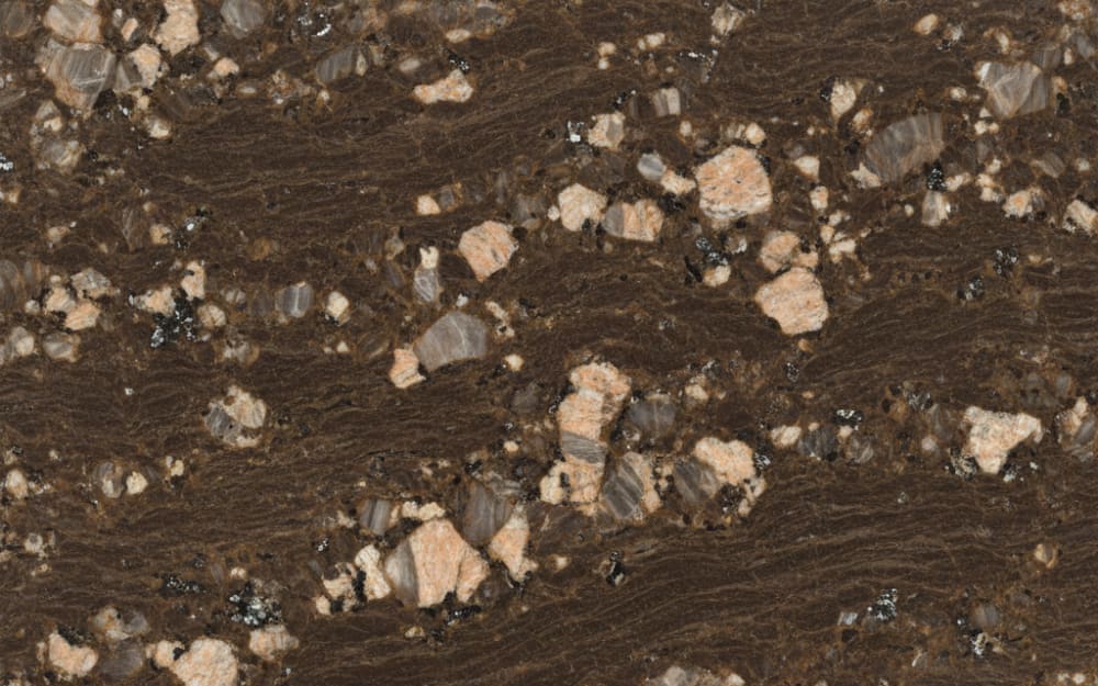 Dream Brown granite — polished slab surface showing Brown coloring. Origin: India. Hardness: 6 Mohs. Acid sensitivity: none.