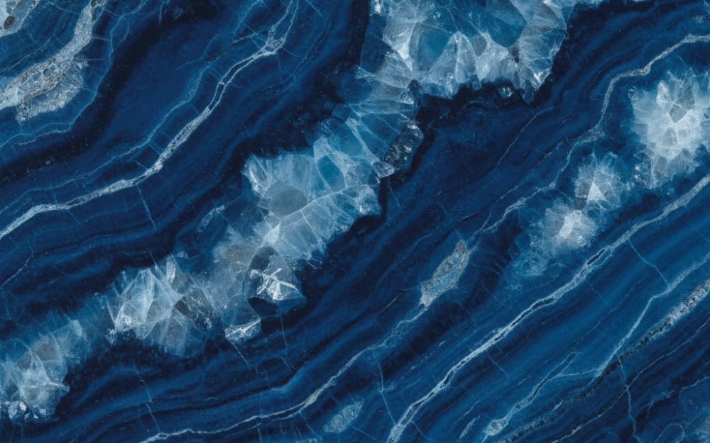 Explosion Blue quartzite — polished slab surface showing Blue coloring. Origin: Brazil. Hardness: 7 Mohs. Acid sensitivity: low.