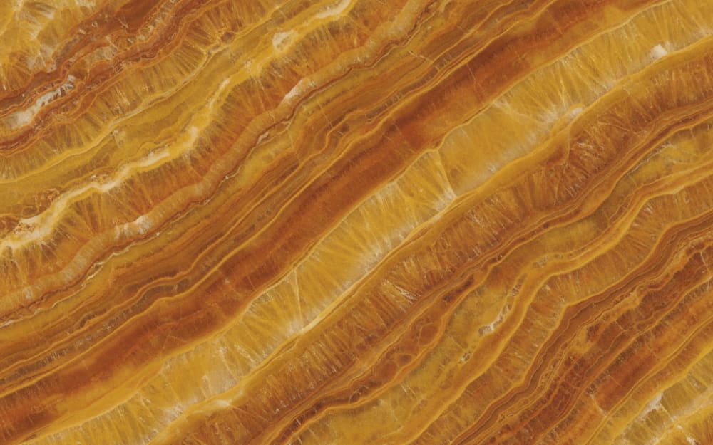 Golden Sun quartzite — polished slab surface showing Gold/Yellow coloring. Origin: Brazil. Hardness: 7 Mohs. Acid sensitivity: none.