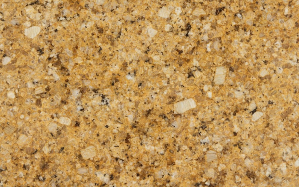 Golden Thunder granite — polished slab surface showing Gold/Yellow coloring. Origin: India. Hardness: 6 Mohs. Acid sensitivity: none.