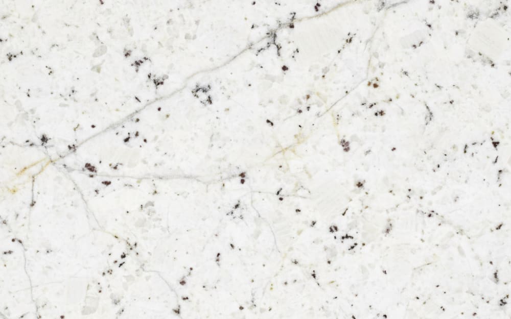 Himalaya White granite — polished slab surface showing White coloring. Origin: India. Hardness: 6 Mohs. Acid sensitivity: none.