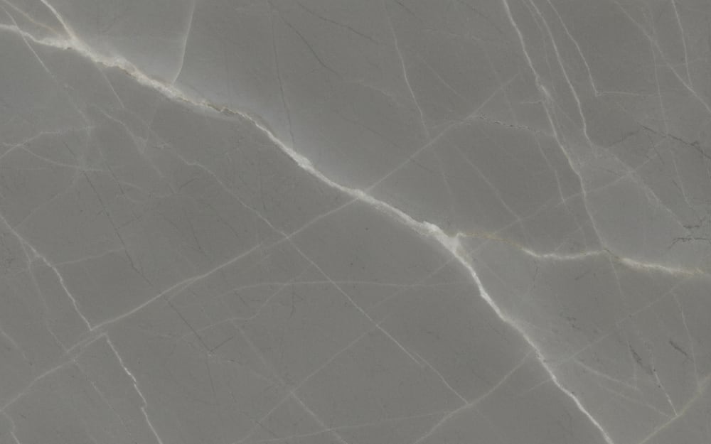 Invisible Grey marble — polished slab surface showing Grey coloring. Origin: Turkey. Hardness: 3 Mohs. Acid sensitivity: high.
