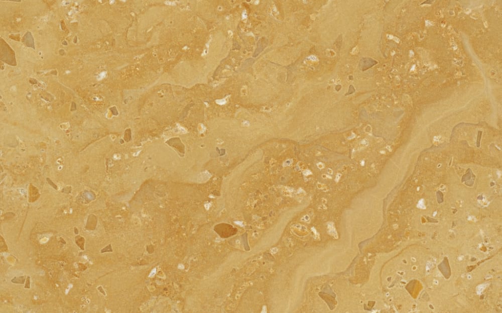 Jerusalem Gold limestone — polished slab surface showing Gold/Yellow coloring. Origin: Israel. Hardness: 3 Mohs. Acid sensitivity: high.