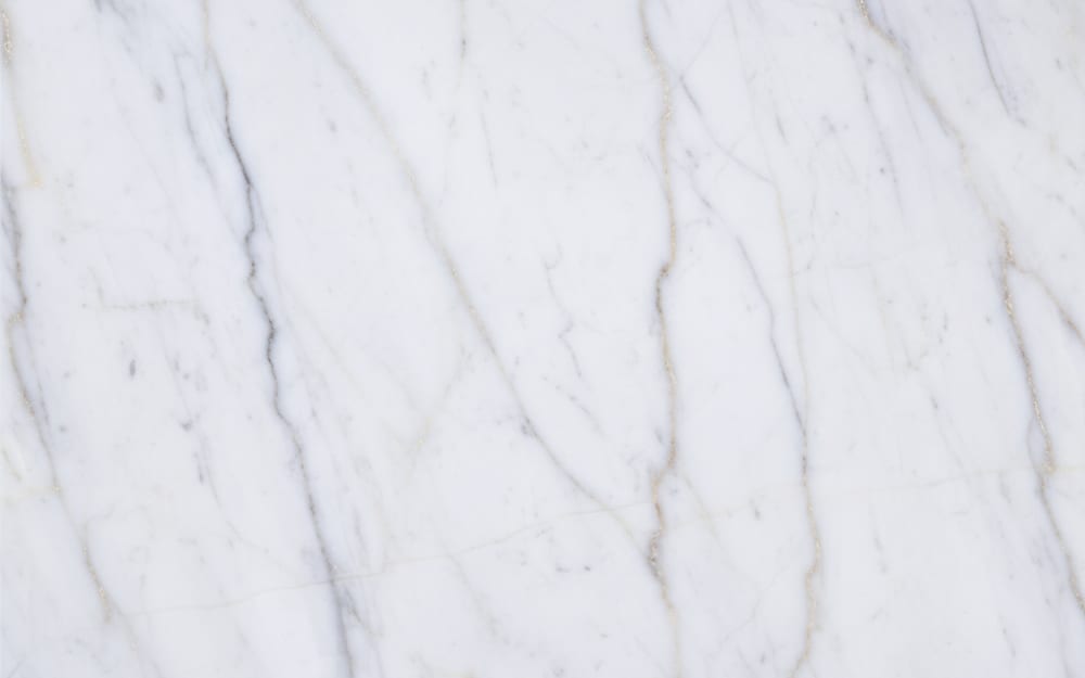 Lilac New York marble — polished slab surface showing White coloring. Origin: Turkey. Hardness: 3 Mohs. Acid sensitivity: high.