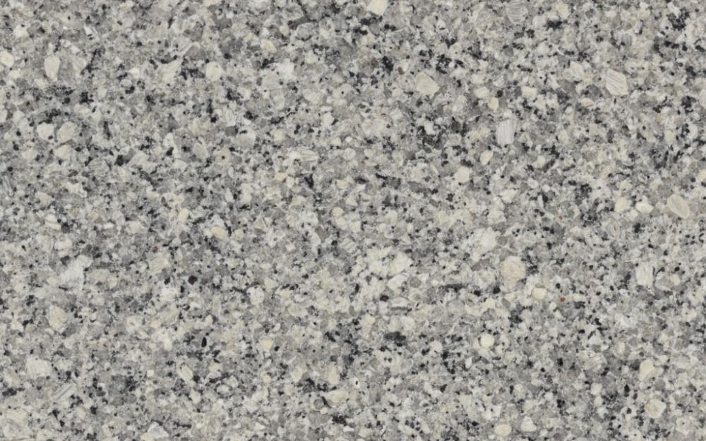 Luna Pearl granite — polished slab surface showing Grey coloring. Origin: Brazil / Norway. Hardness: 6 Mohs. Acid sensitivity: none.